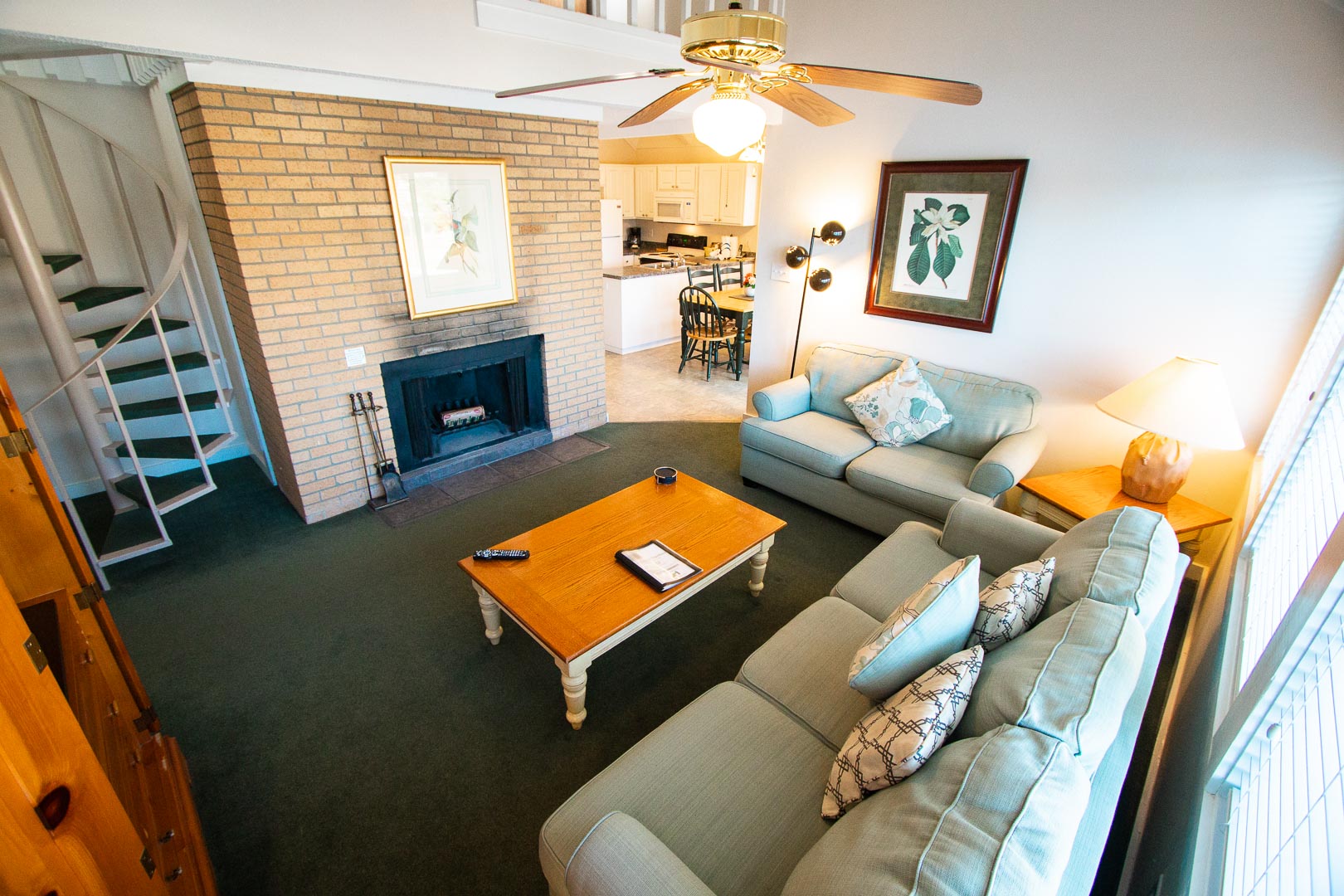 A view of the living room with staircase to the loft at VRI's Waterwood Townhomes in New Bern, North Carolina.